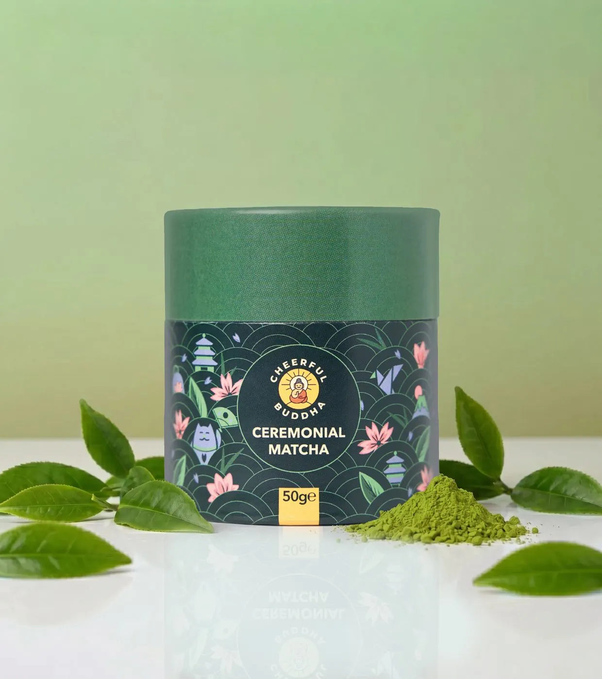 Ceremonial Grade Matcha tube with fresh tea leaves
