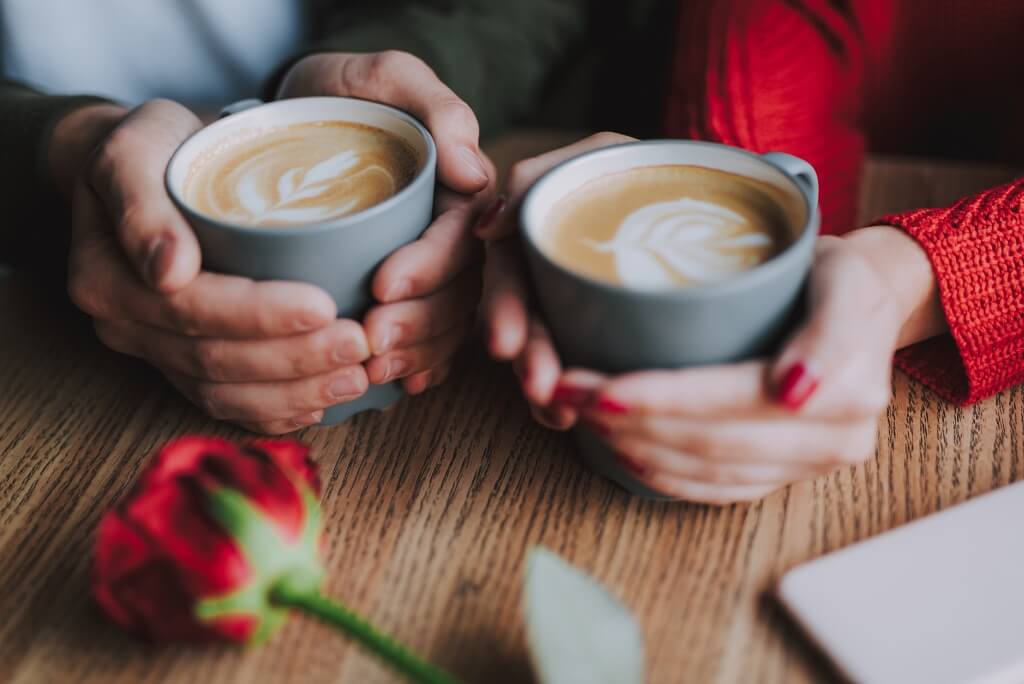 Two people enjoying a cup of Adaptogenic Coffee this Valentine's Day