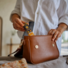 CBD drops 5% with natural orange flavour in a handbag